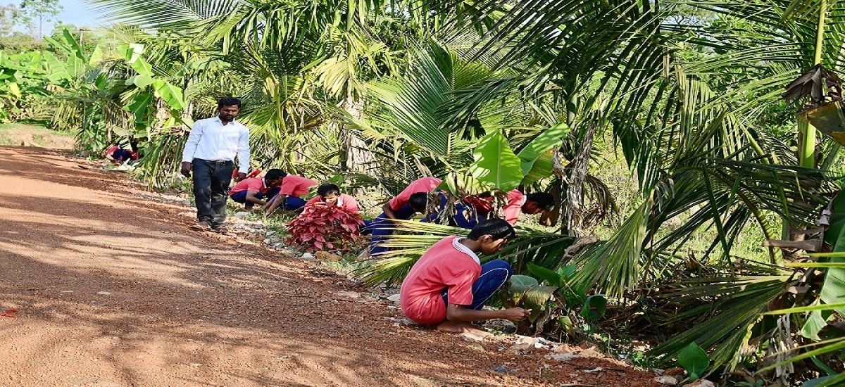 Students gardening on campus at Sri Ramakrishna International Residential School, Sagar